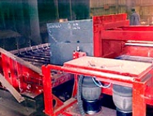 Push-table design discharges mold onto Gamma Low-Level reclamation unit